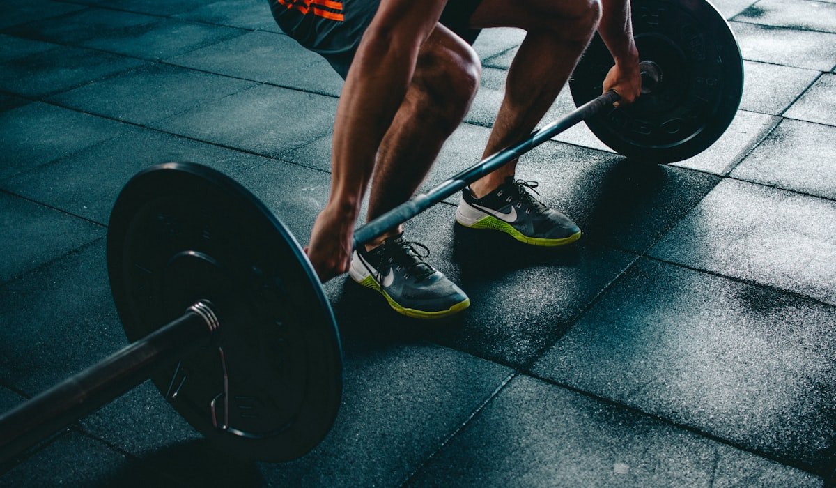 Personal trainer coaching a client through a strength session in an Ottawa gym